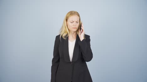 Business-woman-getting-interrupted-and-angry-while-talking-on-the-phone.